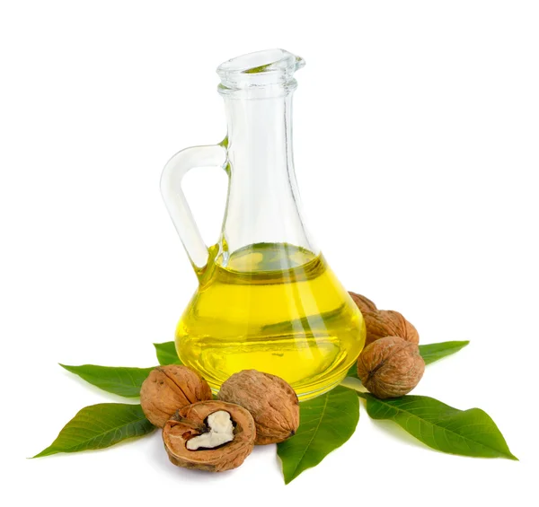 Walnut oil in a glass jug. — Stock Photo, Image