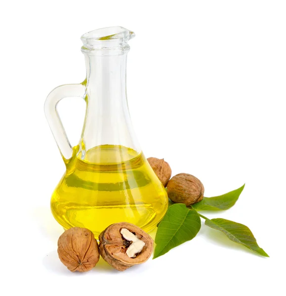 Walnut oil in a glass jug. — Stock Photo, Image