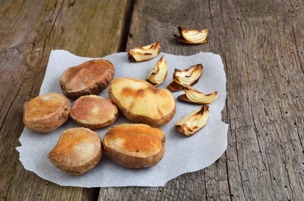 Baked halves of potatoes. — Stock Photo, Image