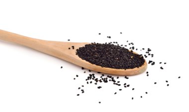 Çörek otu tohumu, tahta kaşık.