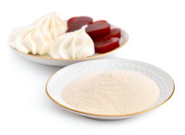 Agar-agar powder on a white plate. On a background Zefir and fru clipart