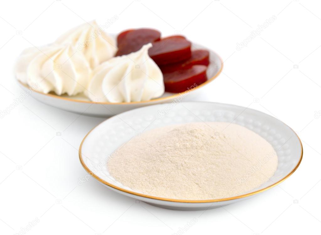 Agar-agar powder on a white plate. On a background Zefir and fru