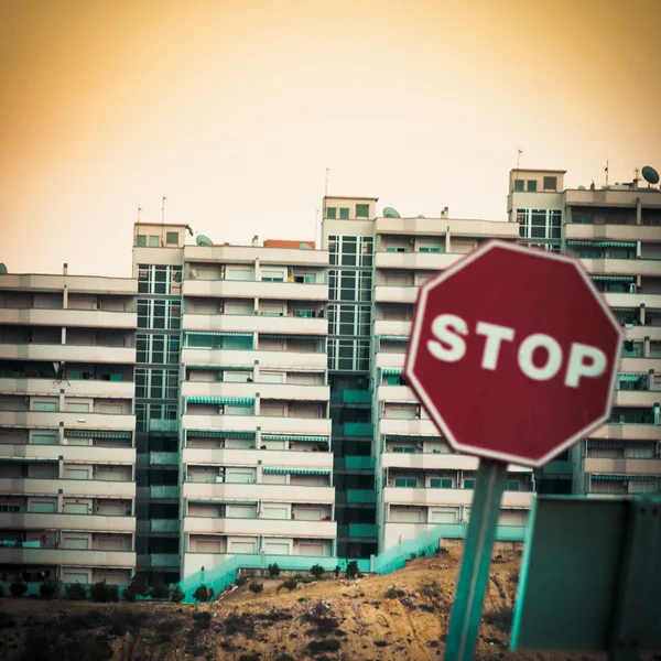 Mobile photography toned stop sign and condo units — Stock Photo, Image