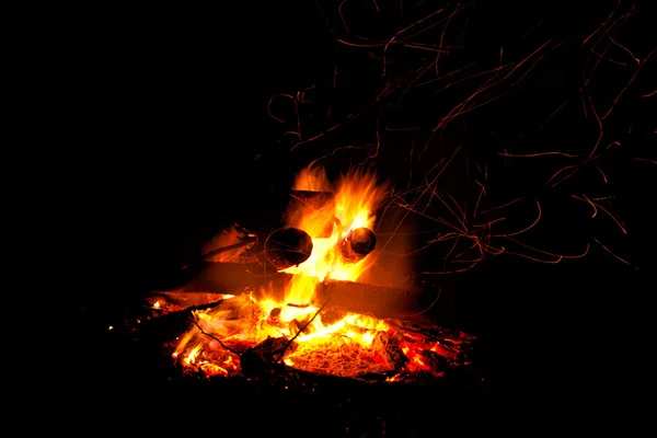 Campfire as a symbol of warmth and life on black — Stock Photo, Image