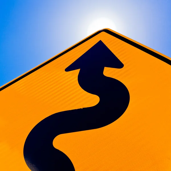 Wavy arrow on road sign pointing up for success — Stock Photo, Image