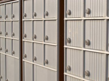 Locker rows of rural Canada Post metal mail box clipart