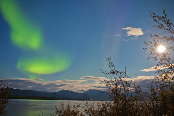 Aurora borealis full moon over Lake Laberge Yukon