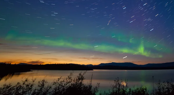 Shooting star meteor Aurora borealis Northern lights Royalty Free Stock Images