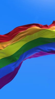 Vertical Rainbow flag, LGBT pride flag or gay pride flag waving at wind, loop 4k. Flag symbol of freedom, peace, and equality. Lesbian, gay, bisexual, transgender, and queer (LGBTQ).