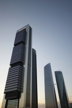 Skyscrapers in Madrid at dusk clipart