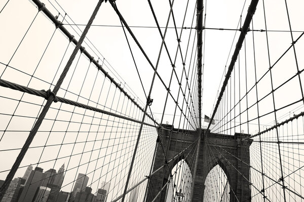 Sepia toned wide angle view of the Brooklyn Bridge in New York City.