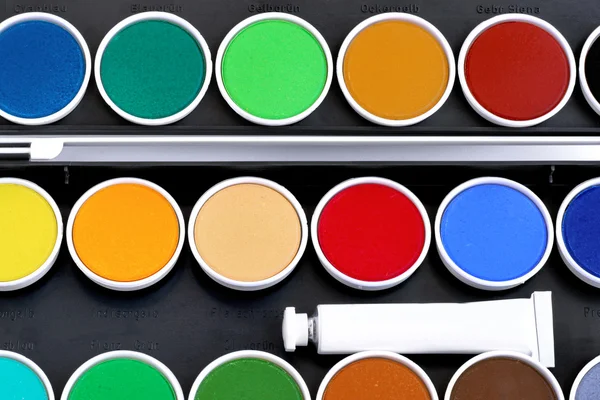 Watercolors with a white tube — Stock Photo, Image