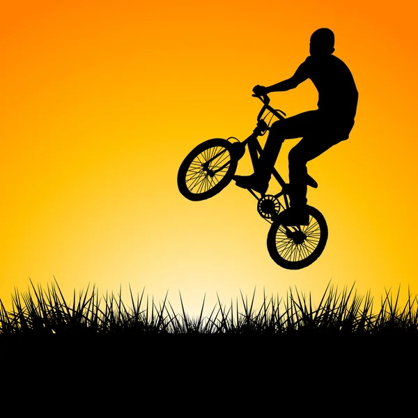 Sylwetka biker skoki w zachodzie słońca — Zdjęcie stockowe