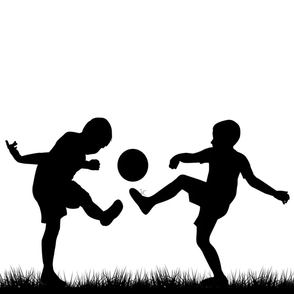 Silhouetten von Kindern beim Fußballspielen — Stockfoto