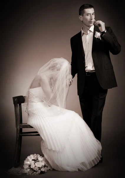 Newly married couple on dark background — Stock Photo, Image