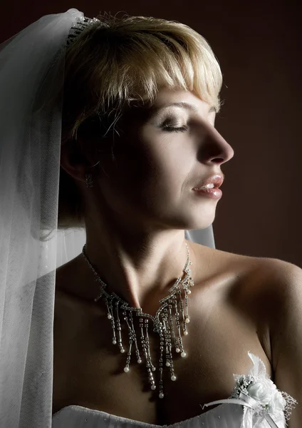 Beautiful bride on dark background — Stock Photo, Image