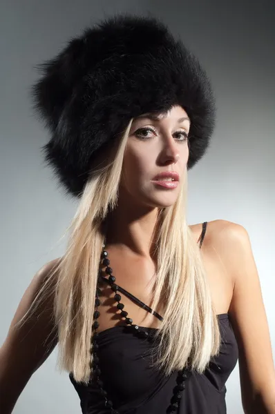 Blond girl in fur hat — Stock Photo, Image