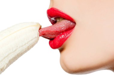 Fgagment female face with a banana close up