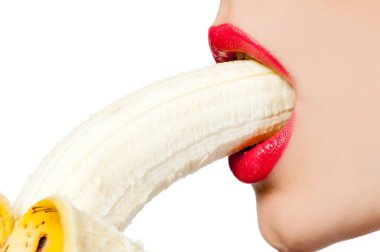 Fgagment female face with a banana close up