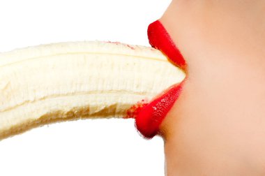 Fgagment female face with a banana close up