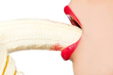 Fgagment female face with a banana close up