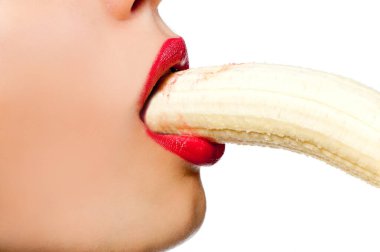 Fgagment female face with a banana close up