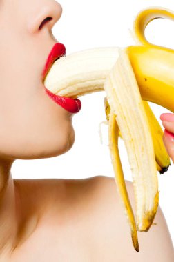 Fgagment female face with a banana close up