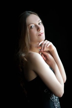 Portrait of beautiful sexy girl on a black background