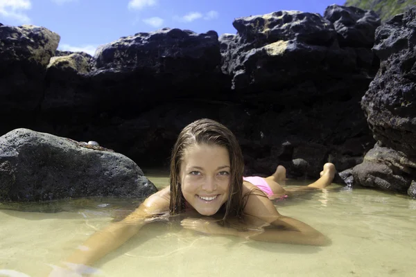 Girl in bikini in a tide pool — Stock Photo, Image