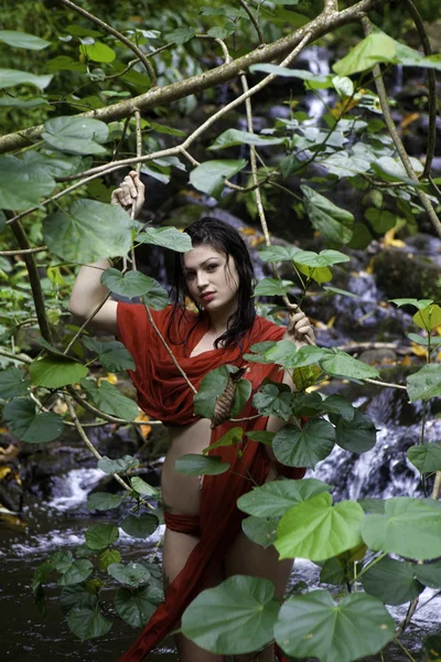 Girl in a waterfall — Stock Photo, Image