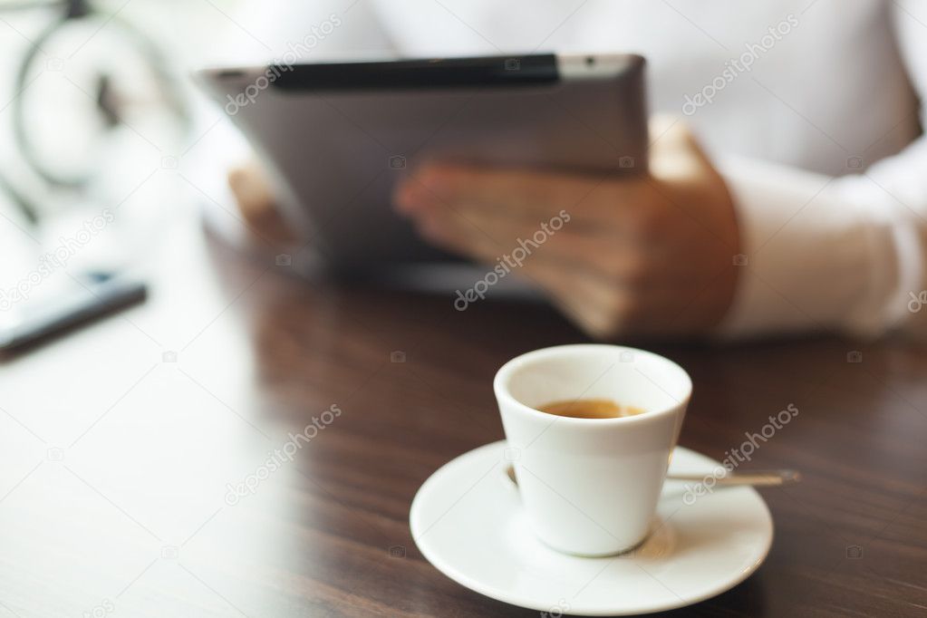 Man Reading News At Motning On Tablet Computer