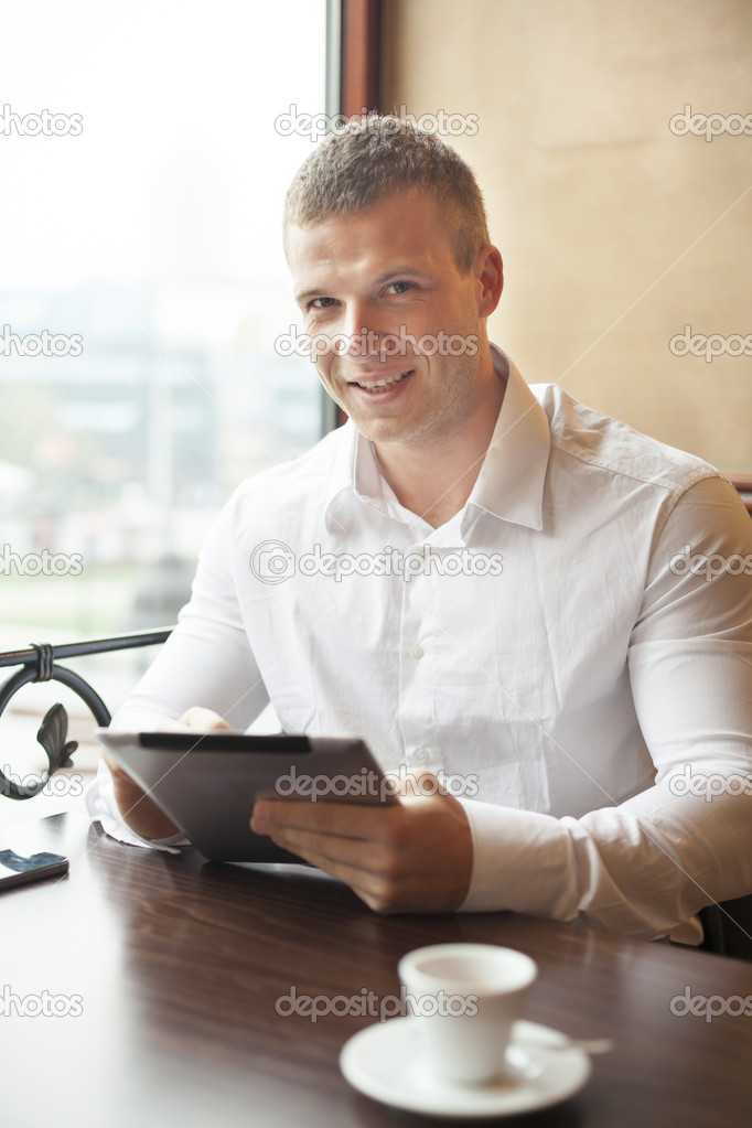 Smiling Businessman on Coffee break in restorant