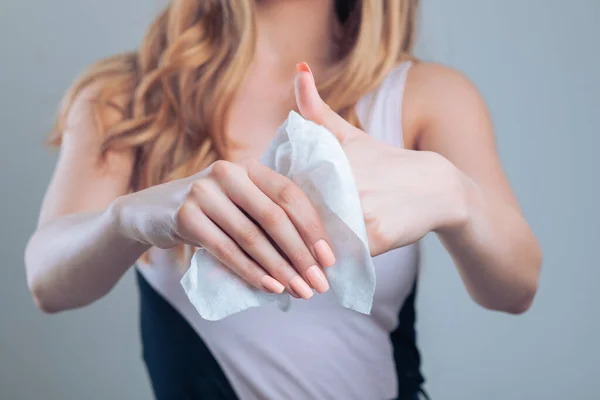 Cleaning hands with wet wipes, prevention of infectious diseases, stock photo