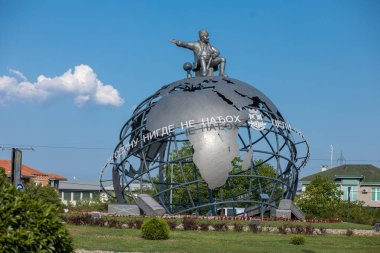 Jagodina, Serbia - July 29, 2022: 3D Globe at the entrance to Jagodina city. Jovanca Micic, world traveler seat on top of globe