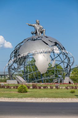 Jagodina, Serbia - July 29, 2022: 3D Globe at the entrance to Jagodina city. Jovanca Micic, world traveler seat on top of globe