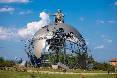 Jagodina, Serbia - July 29, 2022: 3D Globe at the entrance to Jagodina city. Jovanca Micic, world traveler seat on top of globe