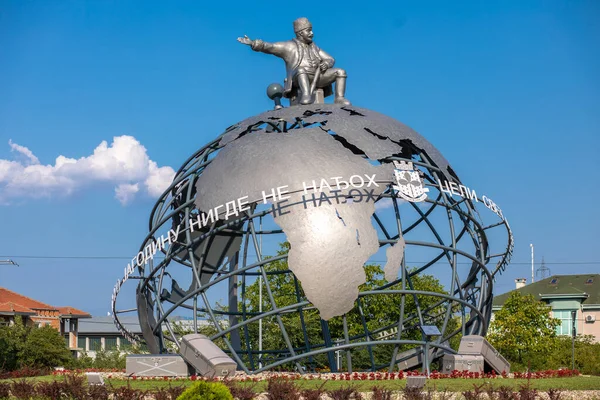 Jagodina, Serbia - July 29, 2022: 3D Globe at the entrance to Jagodina city. Jovanca Micic, world traveler seat on top of globe