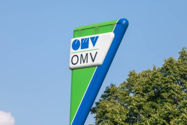 Jagodina, Serbia - July 29, 2022: Logo and sign of OMV on gas station. OMV is a Hungarian-owned oil company operating in Serbia