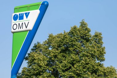 Jagodina, Serbia - July 29, 2022: Logo and sign of OMV on gas station. OMV is a Hungarian-owned oil company operating in Serbia