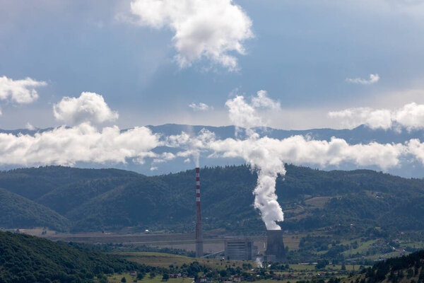 A bigest thermoelectric plant "Pljevlja" near city of Pljevlja in Montenegro, with big chimneys in a rural landscape