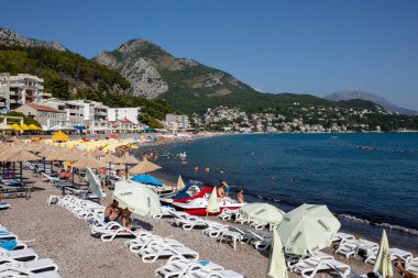 Sutomore, Montenegro - July 15, 2021: Crowd on the beach, famous cheap touristic city Sutomore, Montenegro