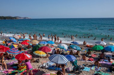 Sutomore, Montenegro - July 15, 2021: Crowd on the beach, famous cheap touristic city Sutomore, Montenegro