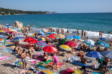 Sutomore, Montenegro - July 15, 2021: Crowd on the beach, famous cheap touristic city Sutomore, Montenegro