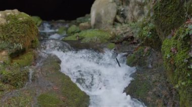 Spring with crystal clear water, waterfall slow motion