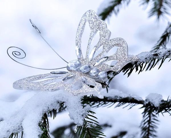 Sparkling batterfly in winter forest — Stock Photo, Image