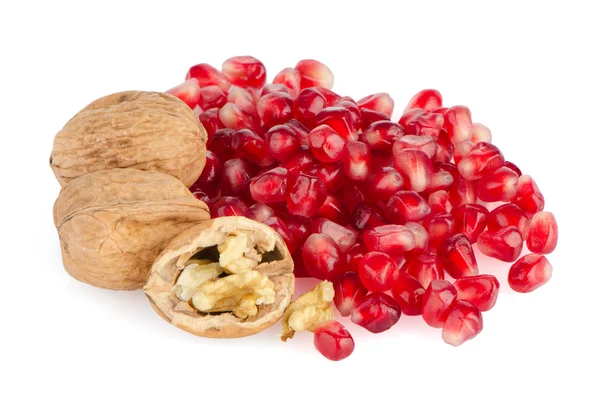 Pomegranate seed pile and nuts — Stock Photo, Image