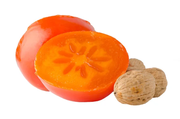 Ripe persimmons and nuts — Stock Photo, Image
