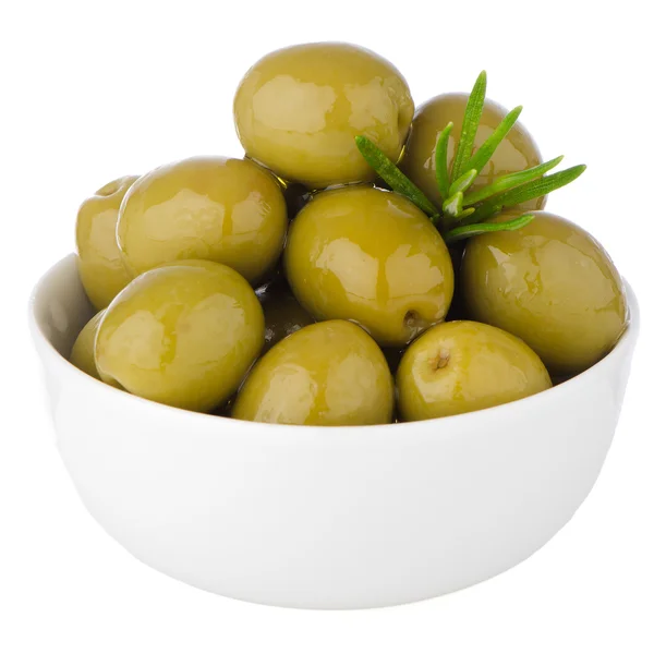 Green olives in a white ceramic bowl — Stock Photo, Image