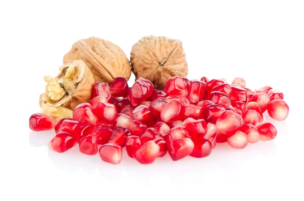 Pomegranate seed pile and nuts — Stock Photo, Image
