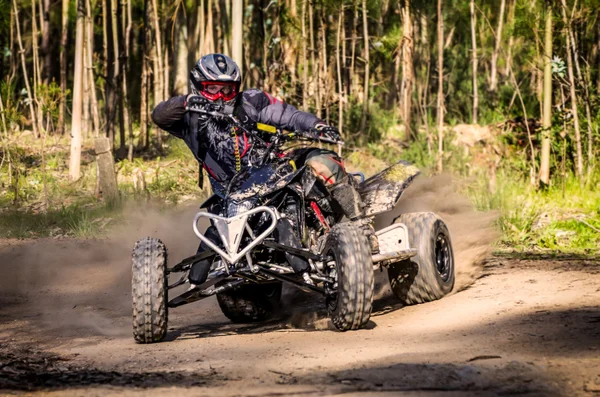 ATV racer takes a turn during a race. — Stock Photo, Image